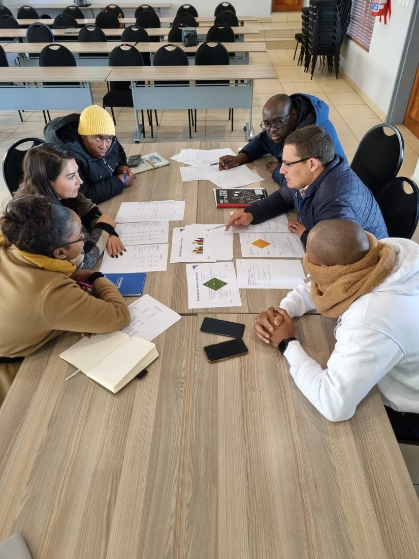 Participants analysing financial acumen materials